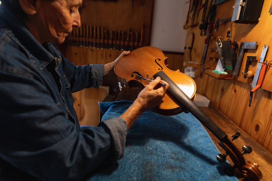 Female luthier at work in a workshop