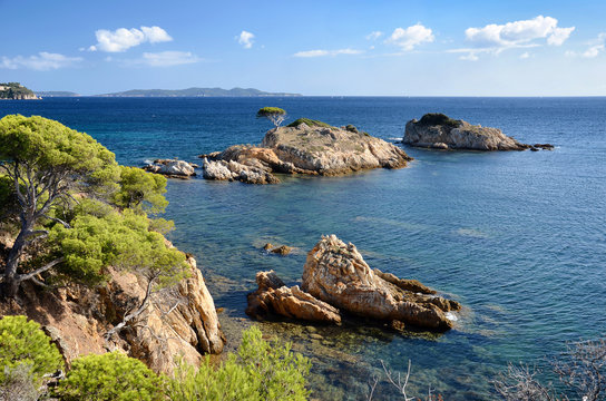 Estagnol tiny island visible from the coastal hiking trail in Bormes-les-Mimosas, France. A typical mediterranean seascape.