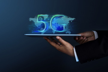 5G Network System Concept. Businessman in Formal Suit Holding a Digital Tablet for Present a New Technology of World Communication, Side view