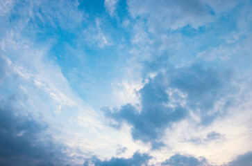 Obraz premium Full frame texture of blue sky filled with contrast grey and white cumulus clouds
