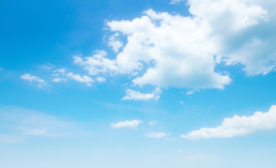 Fototapeta premium Panoramic blue sky background with white fluffy clouds, wide cloudscape banner for summer nature backdrop