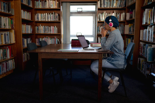Young woman studying in library