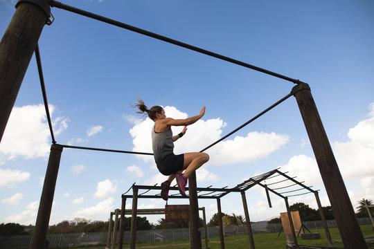 Young woamn training at an outdoor gym bootcamp