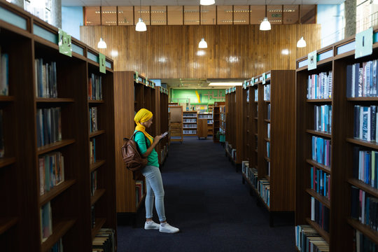 Young woman studying in library