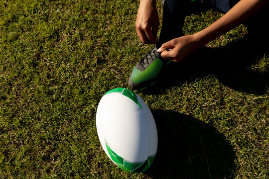 Young adult female rugby player on a rugby pitch