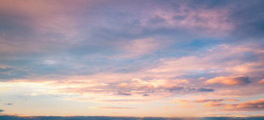 Obraz na płótnie Canvas Dramatic sun ray with orange sky and clouds dawn texture background