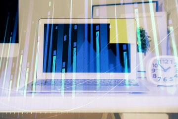 Forex market chart hologram and personal computer background. Multi exposure. Concept of investment.
