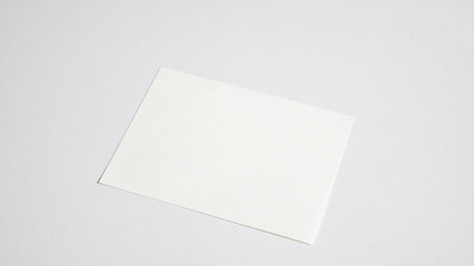 Blank white paper on white background.