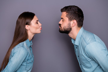 Close-up profile side view portrait of two her she his he nice attractive charming shy sweet tender gentle dreamy person kissing pouted lips first time isolated over gray violet purple pastel