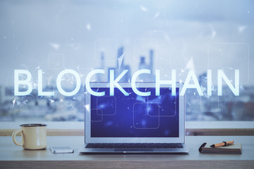 Double exposure of blockchain and crypto economy theme hologram and table with computer background....