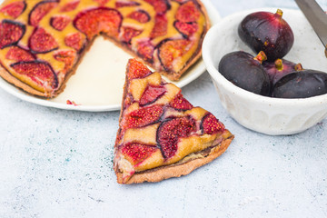 Baked sweet figs cake, pie or tart on plate. Healthy vegan non-diary dessert. 