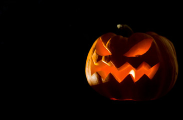 Jack o lantern Halloween on black background with copy space.