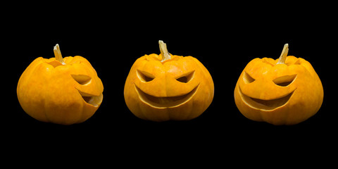 Jack o lantern pumpkin faces on black background.
