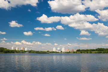 Fototapeta na wymiar Cumulonimbus clouds over lake, city lake in Minsk