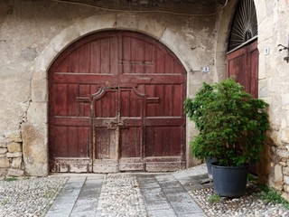 Fototapeta na wymiar Castello di Costa di Mezzate, ITALY. Old windows and doors on stone walls