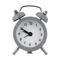 A gray clock with an alarm clock on a white background with arrows showing the time nine hours fifty minutes or twenty one hours and fifty minutes