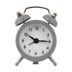 A gray clock with an alarm clock on a white background with arrows showing the time ten hours fifteen minutes or twenty two hours fifteen minutes
