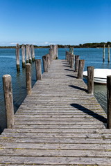 Fototapeta premium an old wooden landing stage at the sea