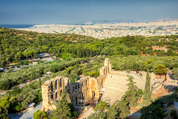 Fototapeta na wymiar Panoramic view of the Theatre of Dionysus at the foot of Acropolis in Athens, Greece. It is one of the main landmark of Athens. Scenic panorama of ancient Greek ruins of Theatre of Dionysus