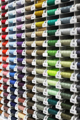 threads of different colors in the store,in the hanging position,in the coil and in the Babin concept fabric shop,thread factory and handmade Warsaw,Poland September 12, 2019,  Store Fashion Colors