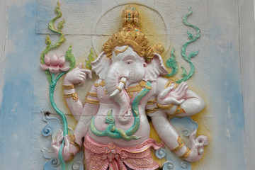 carving decorated ganesha statue on wall