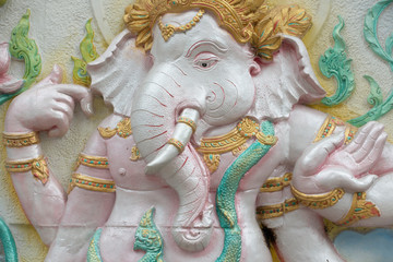 carving decorated ganesha statue on wall