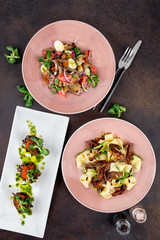 Three salads on a brown background. Restaurant menu