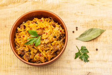 Stewed (braised) cabbage served on ethnic ceramic bowl
