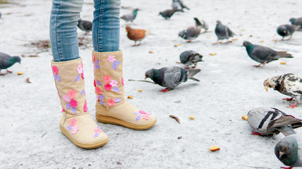 Legs of a girl on a winter walk