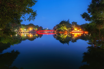 Fototapeta na wymiar The Huc Bridge on the Hoan Kiem Lake in Hanoi, Vietnam