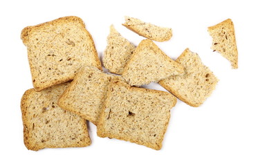 Broken rye toast slices with seeds isolated on white background, top view