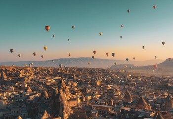 aerial view of city with hot air balloon in Cappadocia