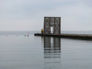 wooden jetty by the sea, Curonian Lagoon in Nida resort town, Neringa, Lithuania