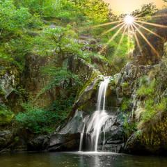 Waterfall during sunset in Auvergne, Saint-Priest-des-Champs, France