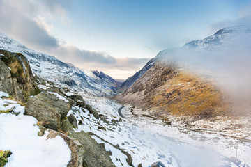 Snow covered mountain range in snowdonia, wales, United Kingdom.