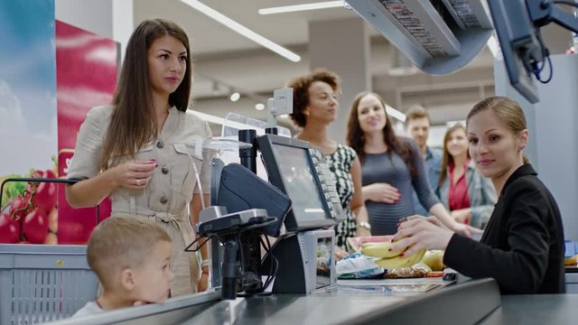 Woman buying goods in a grocery store
