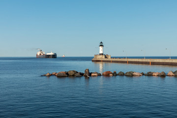 A Ship And A Lighthouse On Lake Superior