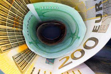 Inside the money tunnel. Abstract perspective view of euro back notes rolled in a tube. Saving and investing money