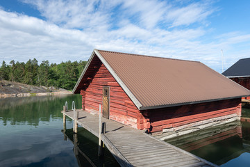 Red boathouse in Finland archipelago.