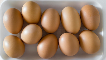 brown colored eggs in plastic package