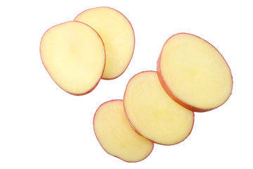 Raw red potato with slices isolated on white background. top view