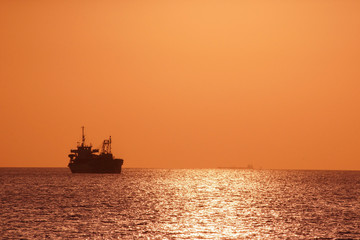 Ship silhouette and sunset