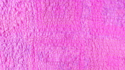 Fototapeta premium pink textured surface of scarf from crushed cotton