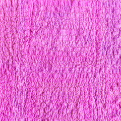 wrinkled surface of scarf from crushed pink fabric