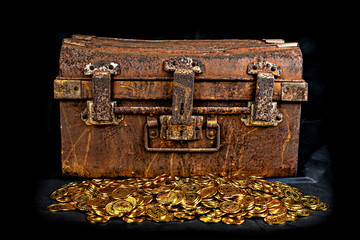Stacking Gold Coin in treasure chest at black background