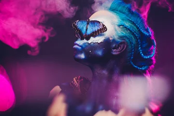 Badezimmer Foto Rückwand Beautiful woman with blue hair and butterfly © Nejron Photo