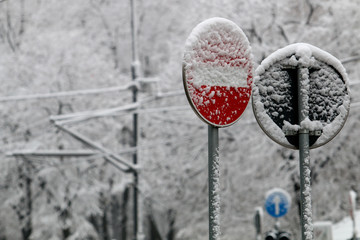 Road signs in the snow on a winter road