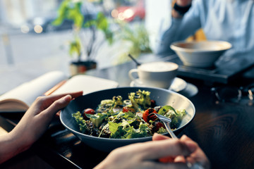 woman preparing salad in kitchen