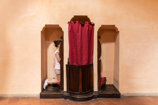  woman in the confessional on church