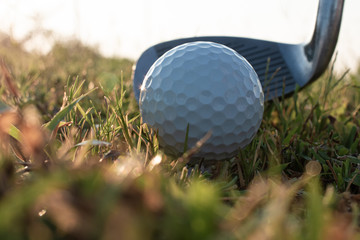Close up golf ball with club